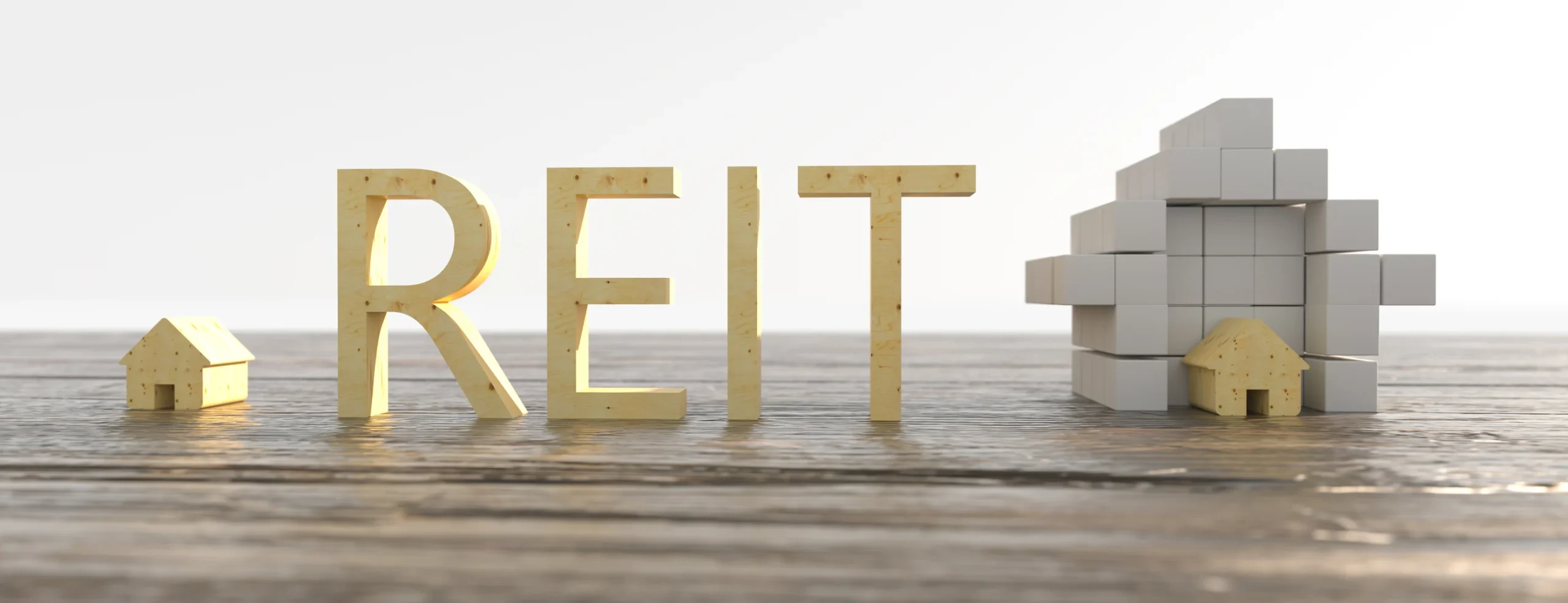 The image displays the word "REITs" formed with golden 3D letters, placed on a wooden surface. To the left of the text is a miniature house, and to the right is a structure made of white cube-shaped blocks with a golden house-shaped block at the top. | MONEY6X