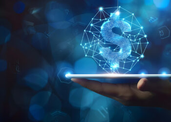 A hand holds a glowing tablet with a digital dollar sign, crafted from interconnected blue nodes and lines, representing Smart Money. The dark background, adorned with soft blue lights and geometric shapes, enhances the futuristic vibe. | MONEY6X