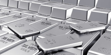 Stacks of shiny silver bars arranged closely together, with some bars slightly askew. Each bar is stamped with "FINE SILVER 999.9" and weight information. The surface reflects light, creating a metallic sheen. | MONEY6X