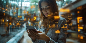 A woman in a modern indoor space looks at her smartphone, surrounded by floating digital graphs, charts, and data icons, representing technology and data analysis. | MONEY6X